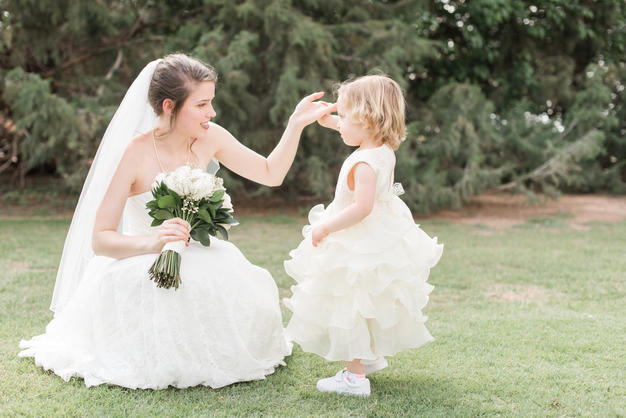 Bride with flower girl spinning