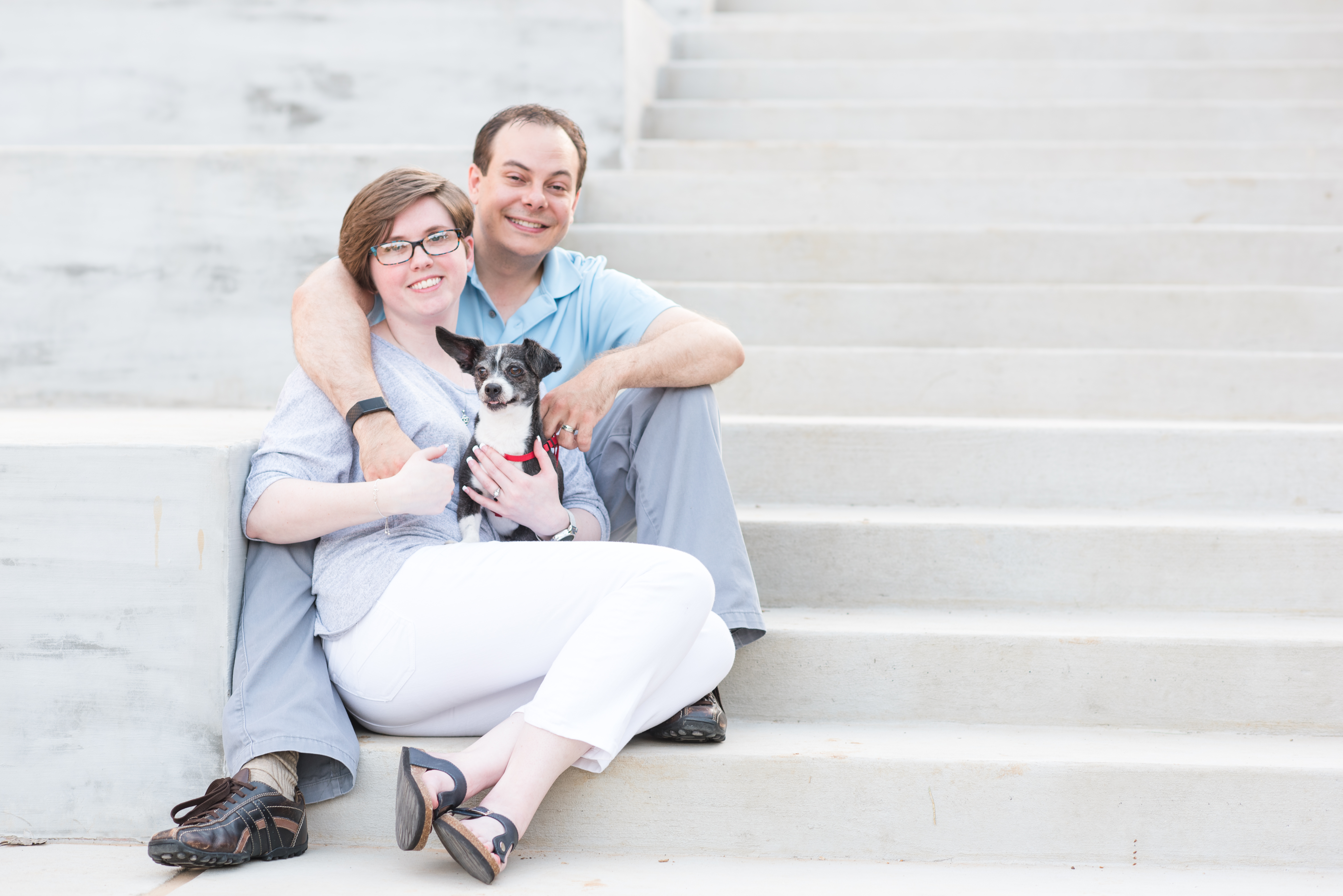 young Forth Worth couple with dog on stairs at UNT
