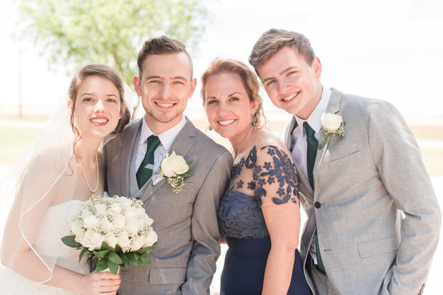 Bride and groom with grooms family