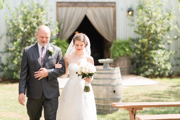 Bride walking down aisle with her father