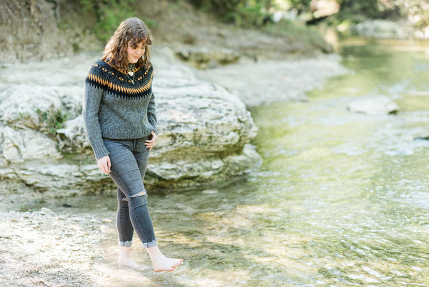 high school girl barefoot in creek