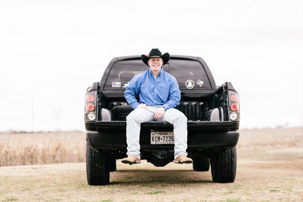Texas senior cowboy on truck photo