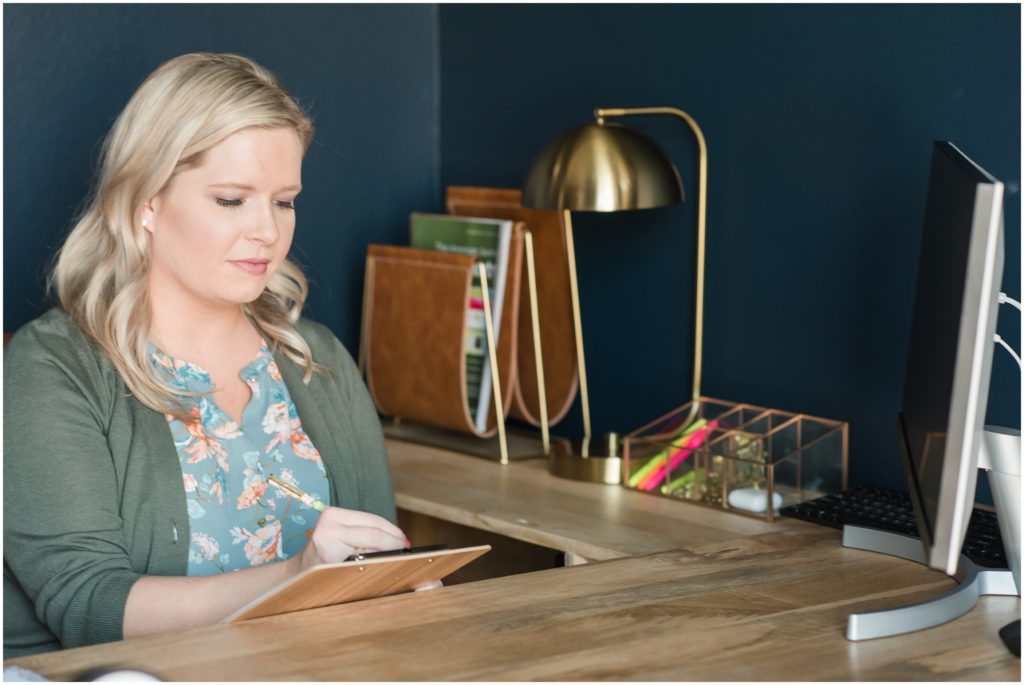 DFW woman at desk on brand photo session