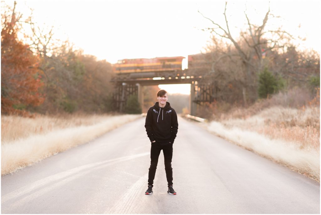 Texas fall senior session of guy in front of train