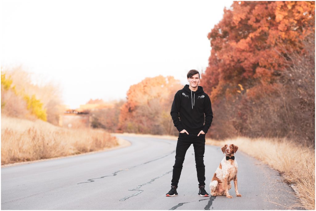 Texas fall senior session of guy with dog and leaves changing colors