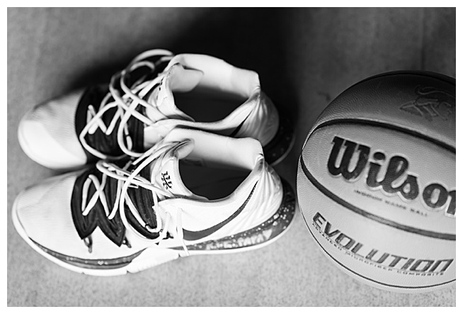 black and white image of basketball and shoes