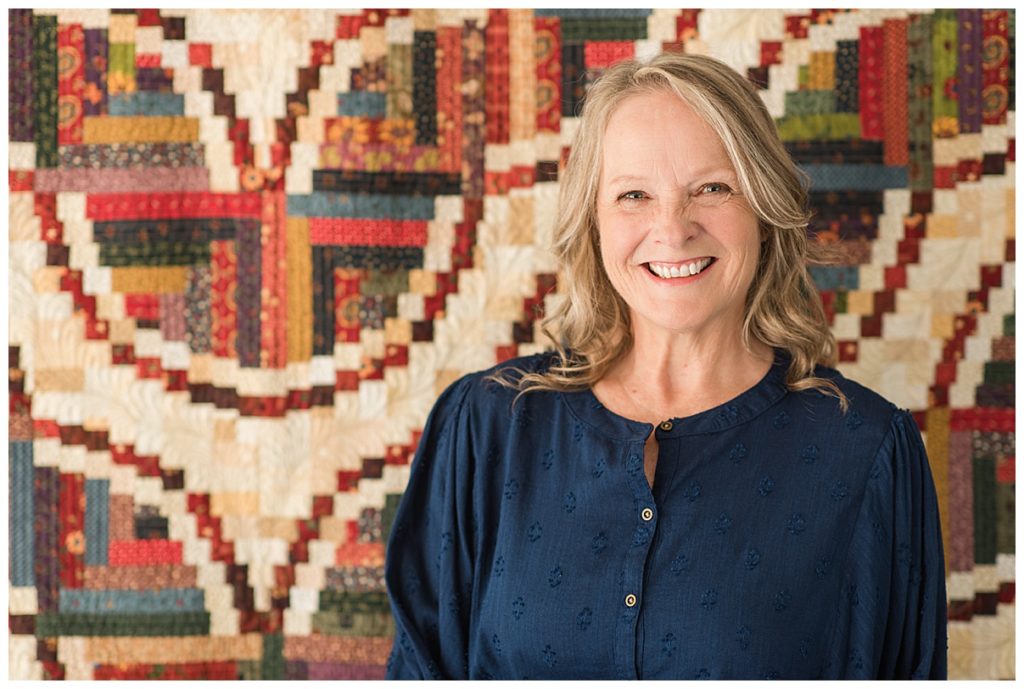 headshot of quilter with quilt