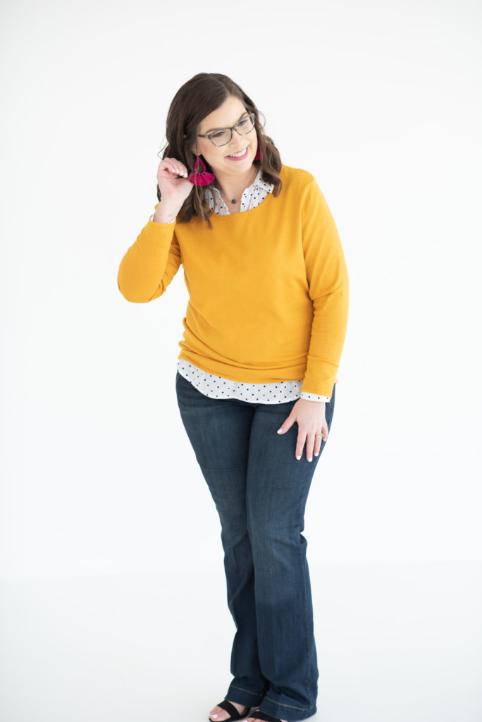 woman in yellow sweater looking off camera