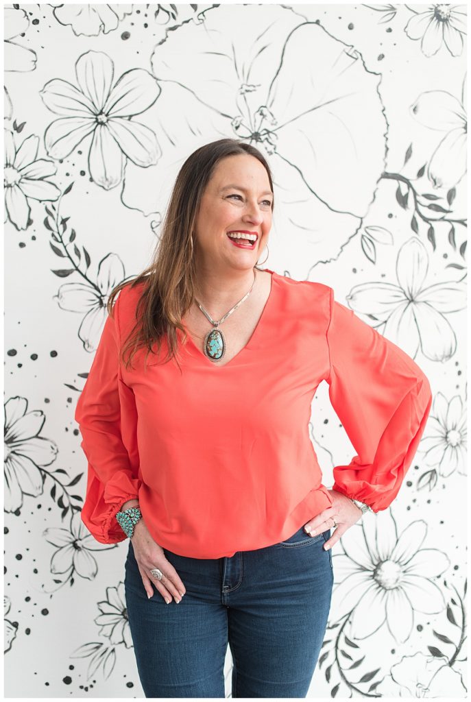 female business owner wearing a bright top