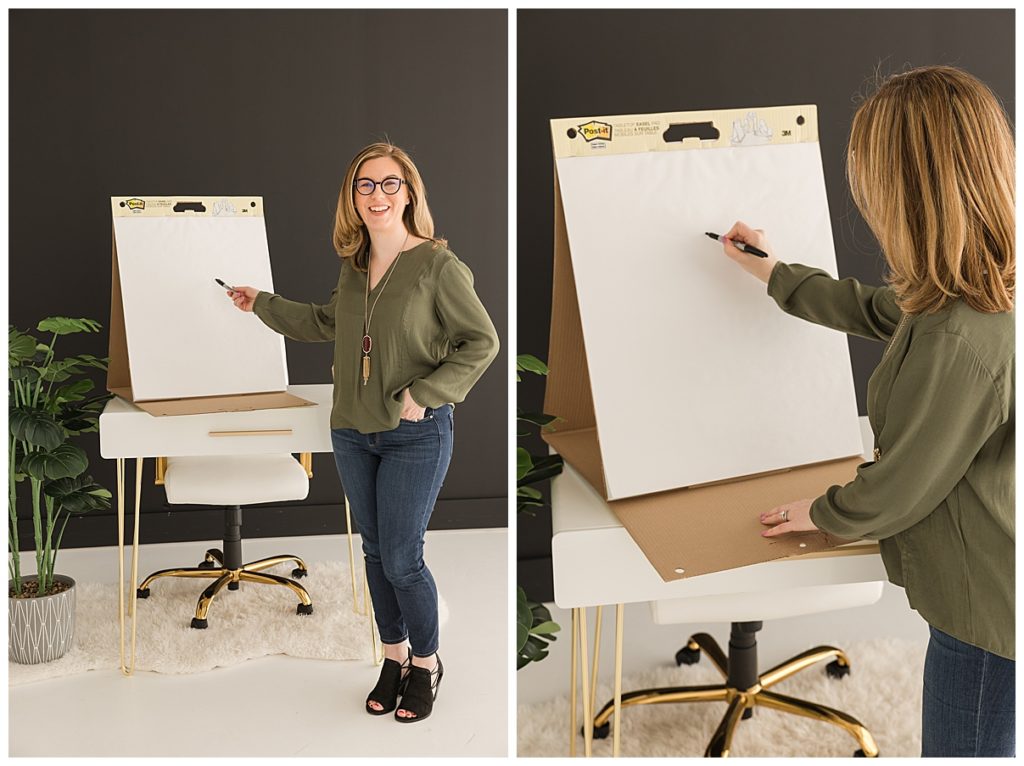 business woman writing on flip chart