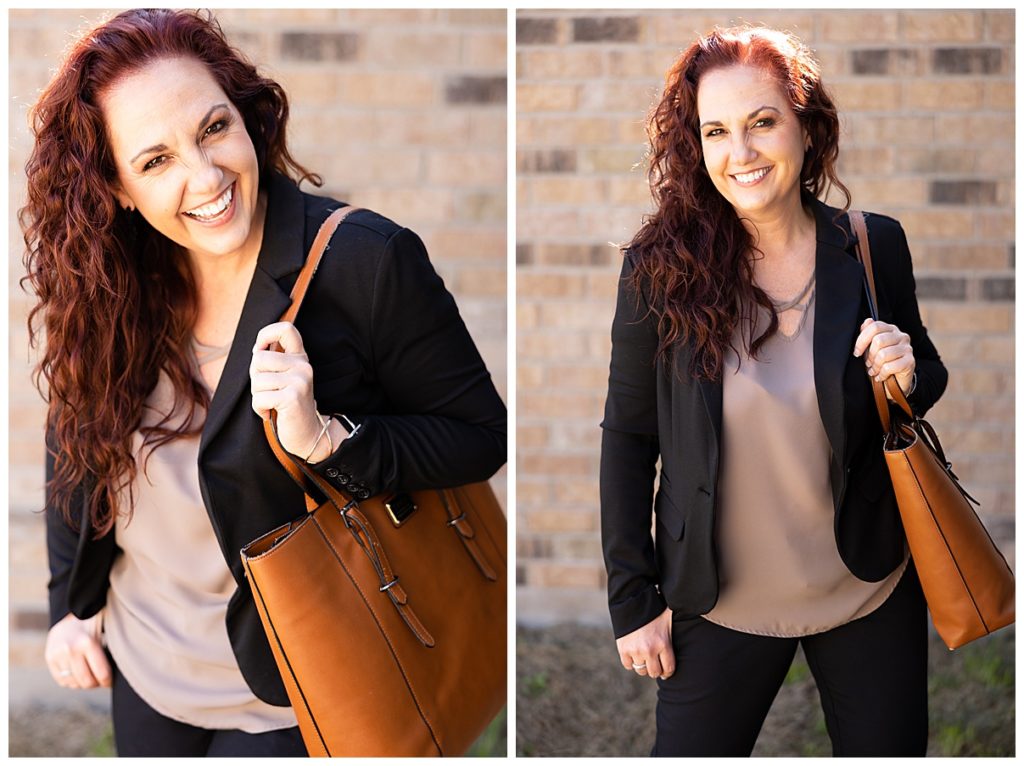 woman in black blazer with brown bag