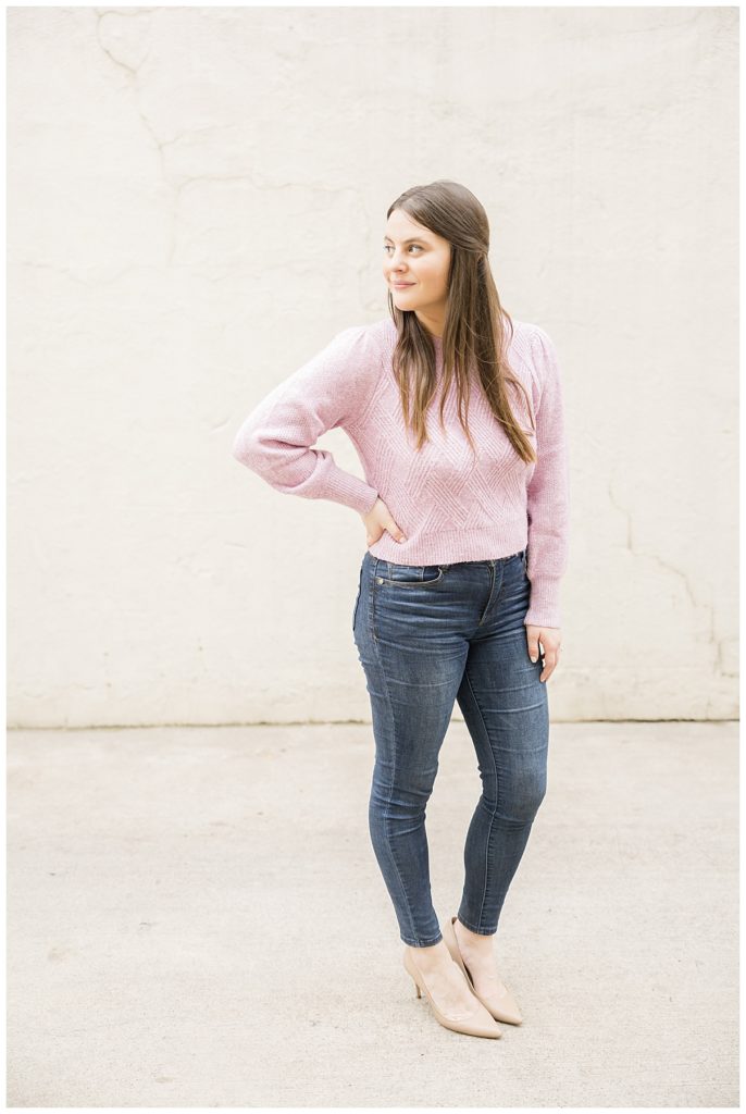Lifestyle branding image of woman in cozy pink sweater